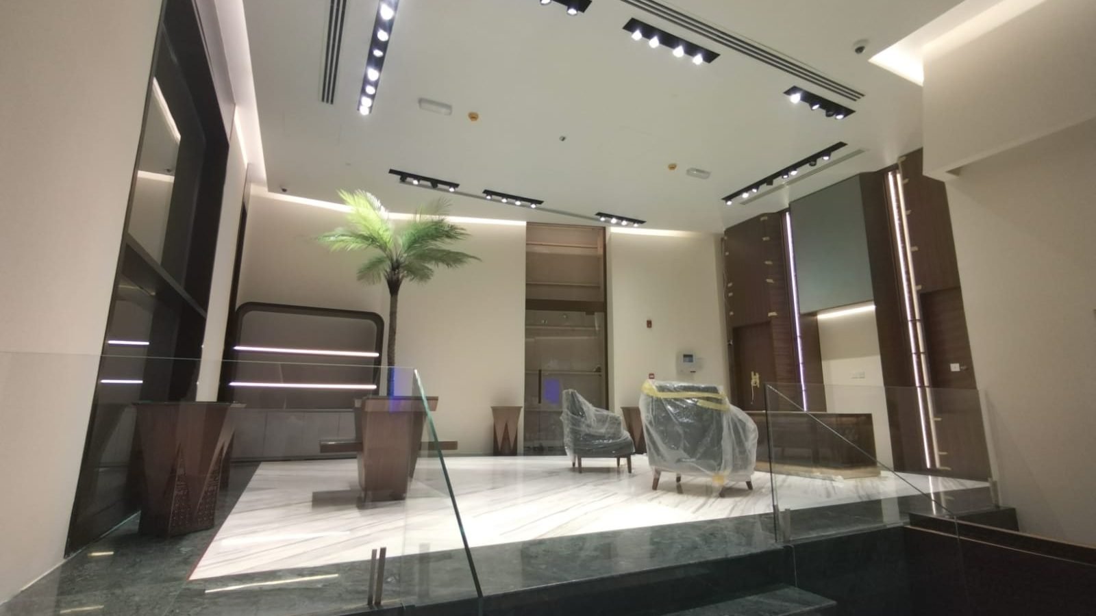 Arabian Oud retail interior with dark timber panelling and display counters
