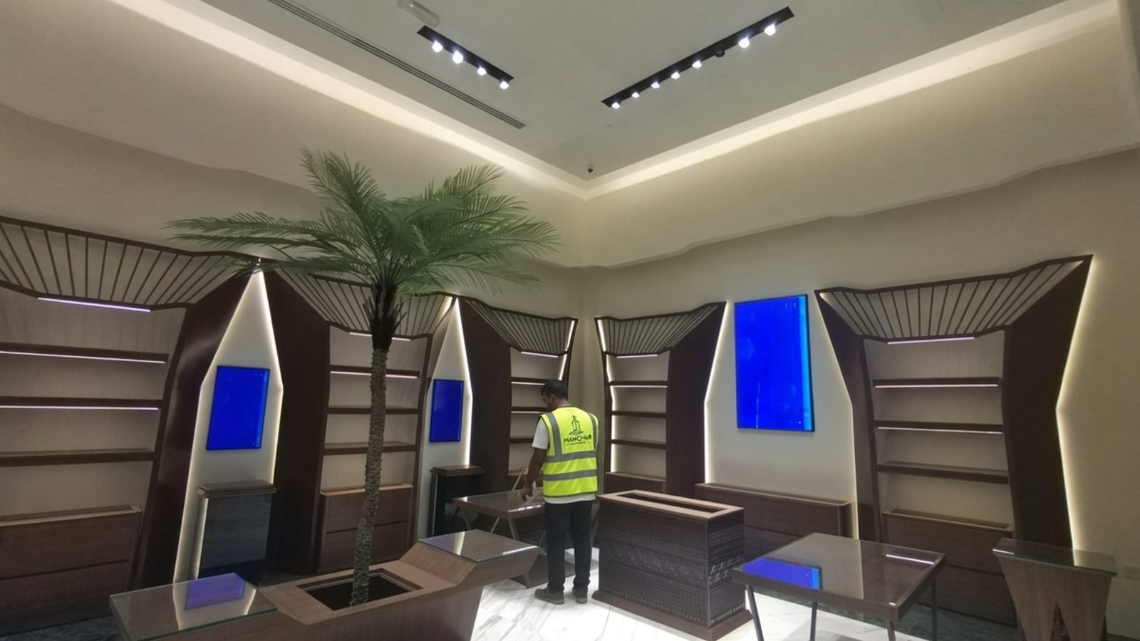 Arabian Oud showroom with illuminated display niches and timber joinery