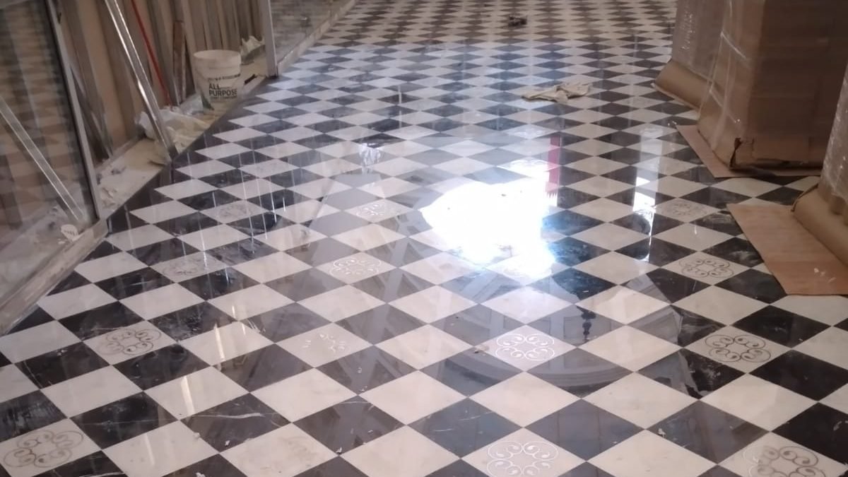 Polished marble chequerboard floor handed over at Bacha Coffee, Villagio Doha