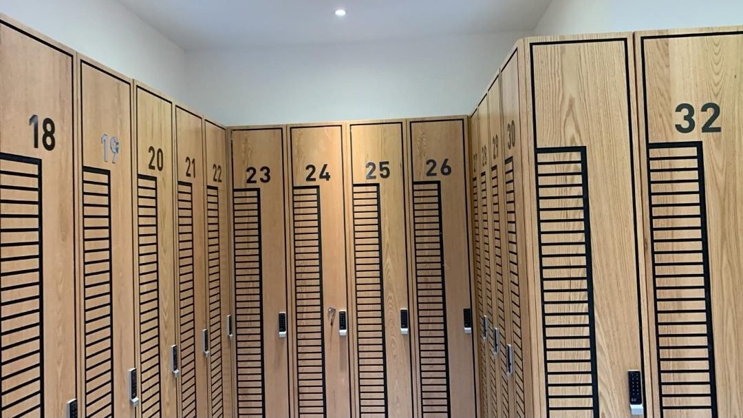 Numbered timber locker room completed by Hawchar Contracting at Edge Iconic gym, Doha