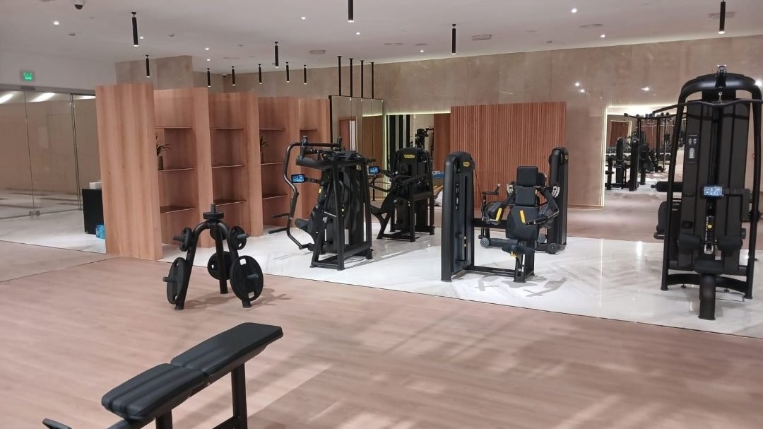 Finished gym floor with fitness equipment at Edge Iconic Doha, interior fit-out by Hawchar Contracting