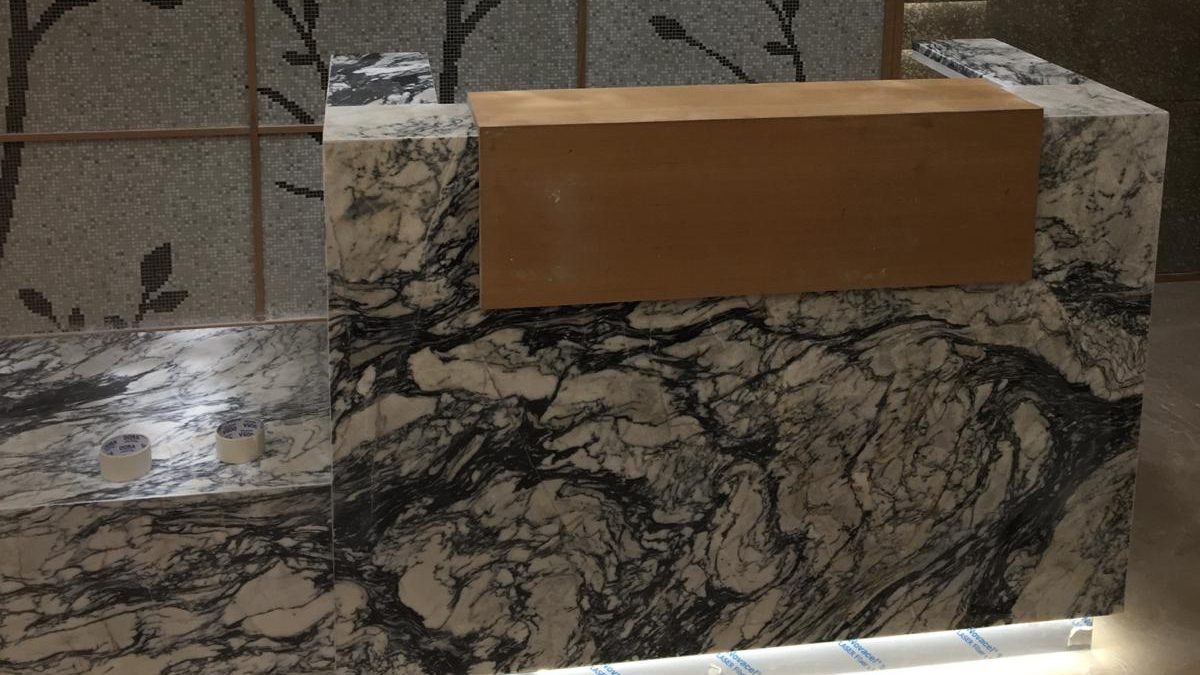 Marble reception counter with timber top at the Marriott Marquis City Center gym in Doha