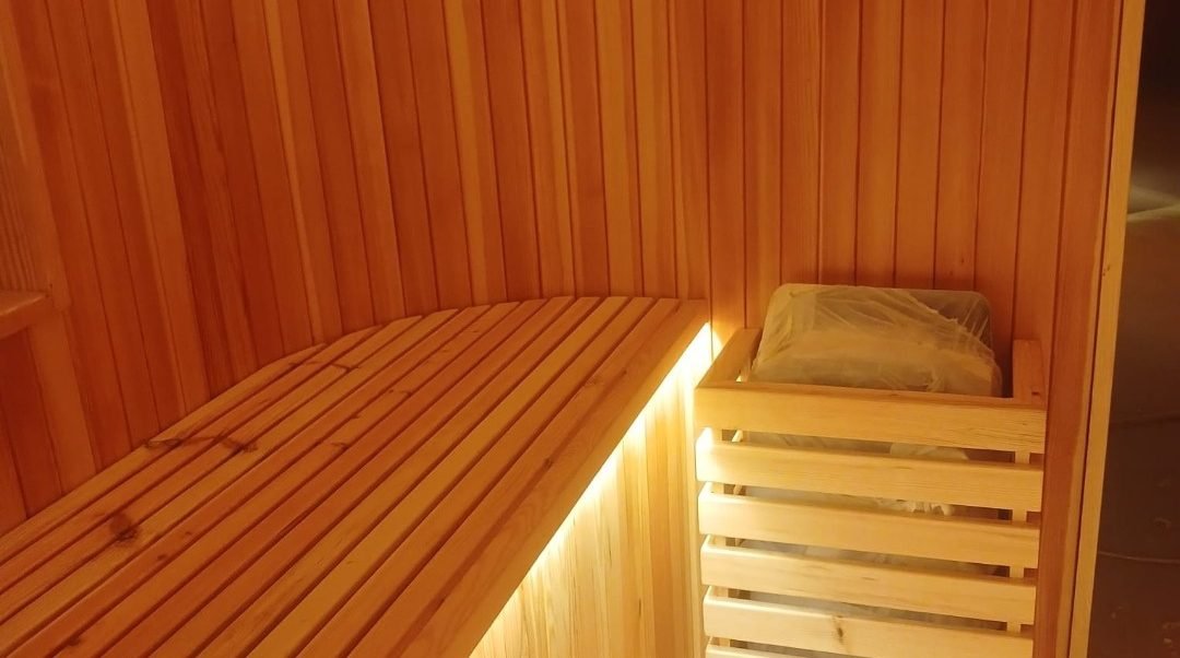 Sauna bench and headrest carpentry detail in cedar, St. Regis Al Mouj Muscat