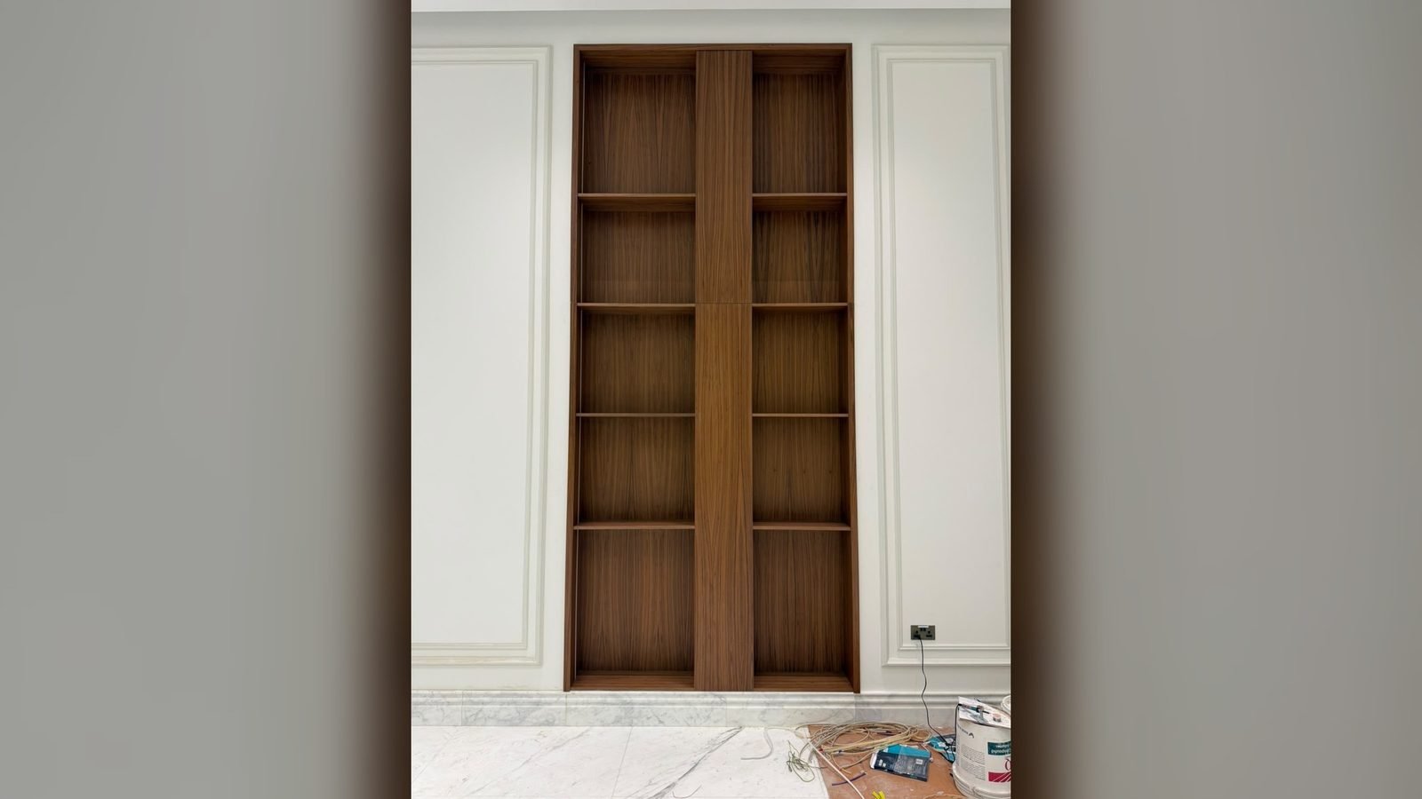 Timber display niche set into a marble wall, feature joinery in Doha