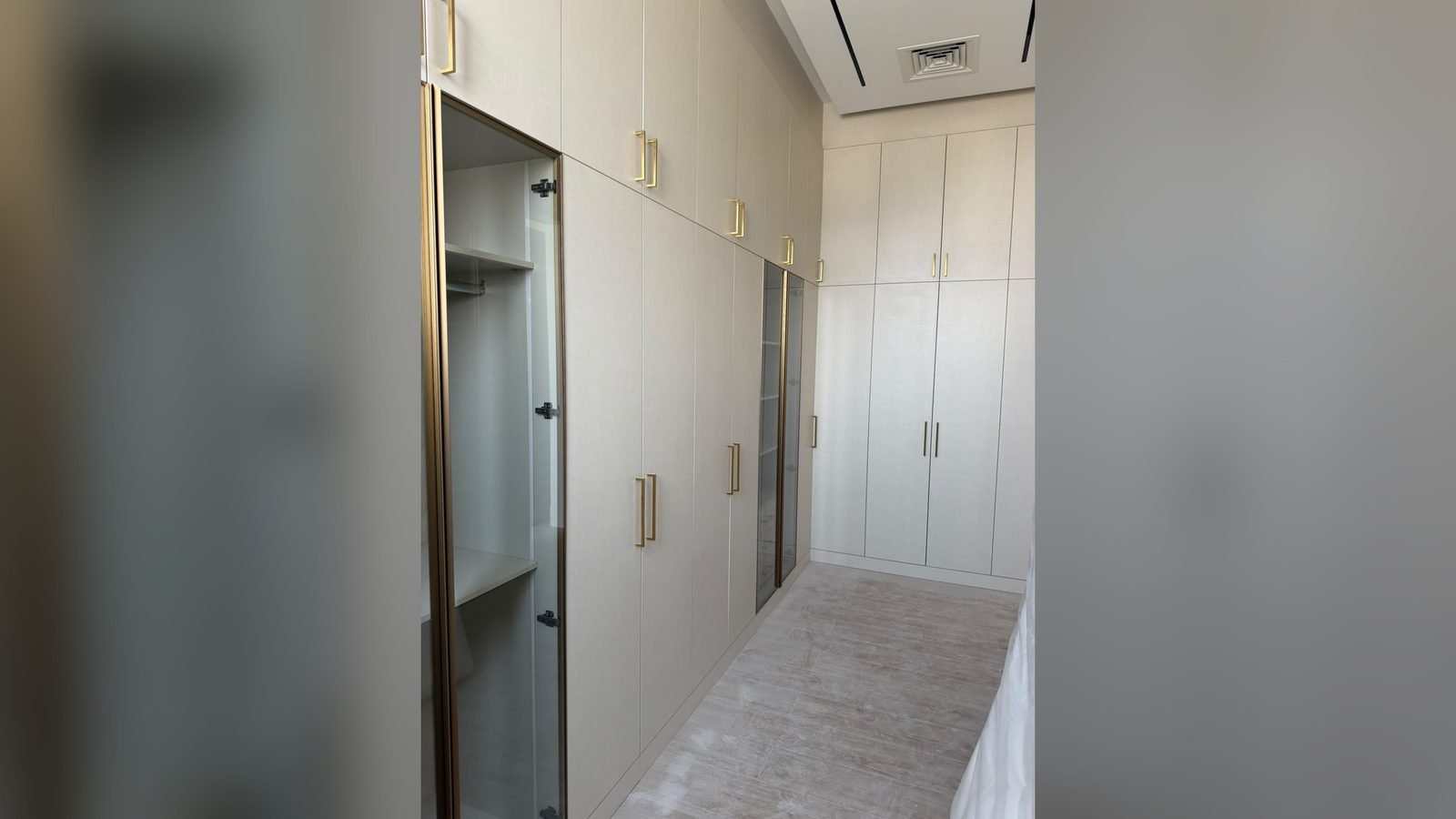 Built-in wardrobe wall along a corridor, interior fit-out in Qatar